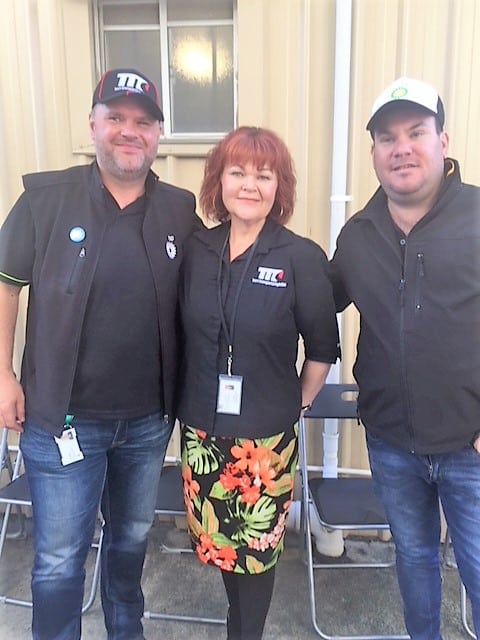 An image of three employees standing with each other from Team Transport & Logistics